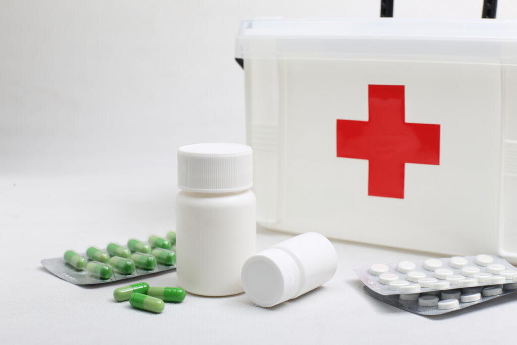 medicine bottles and home medical kit Журналист