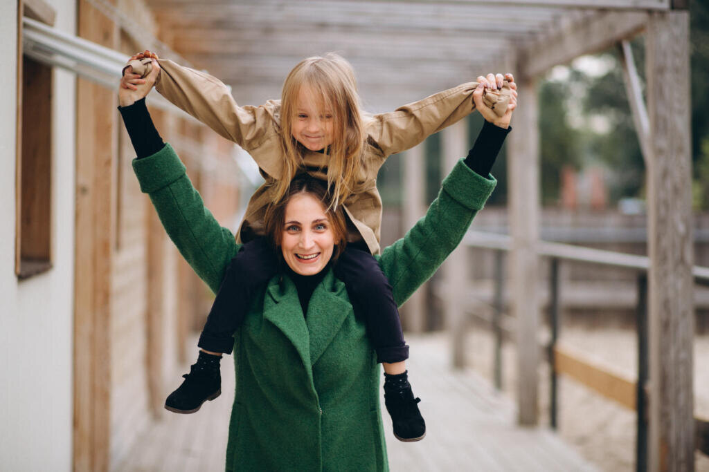 Mother and daughter walking around the stable Журналист
