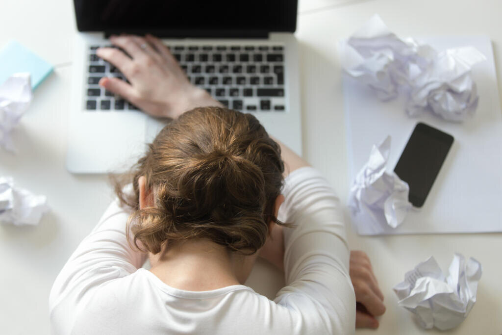 Top view portrait of a woman lying at the desk near the laptop. Education, business concept photo. Lifestyle Журналист