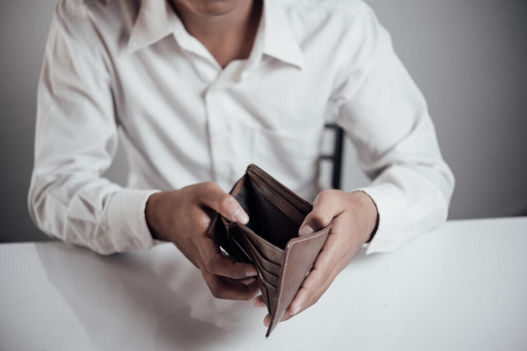 businessman saving money, Close up man carrying a wallet in hand, the dollar,finance accounting concept Журналист